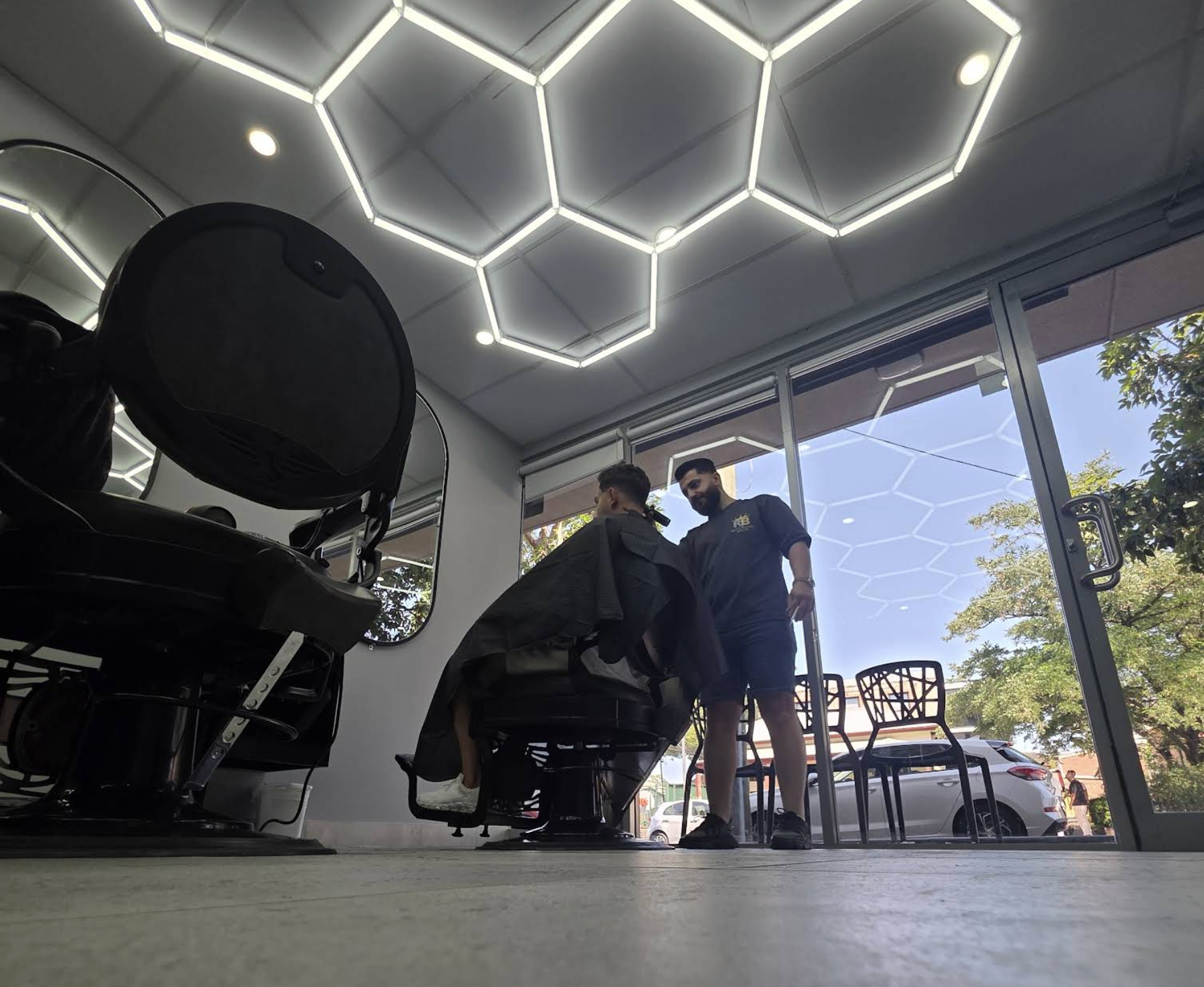 Barber working inside Ray's Blend House